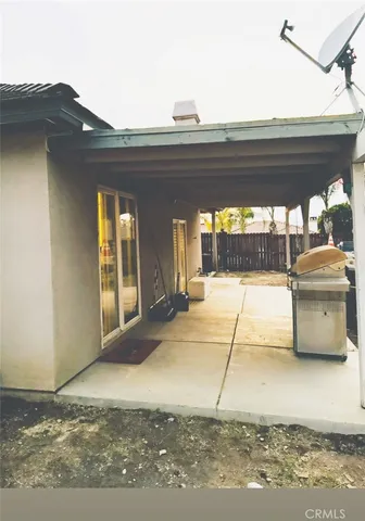 a view of a livingroom with furniture and floor to ceiling window