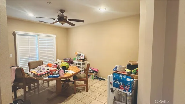 a dining room with furniture and a chandelier