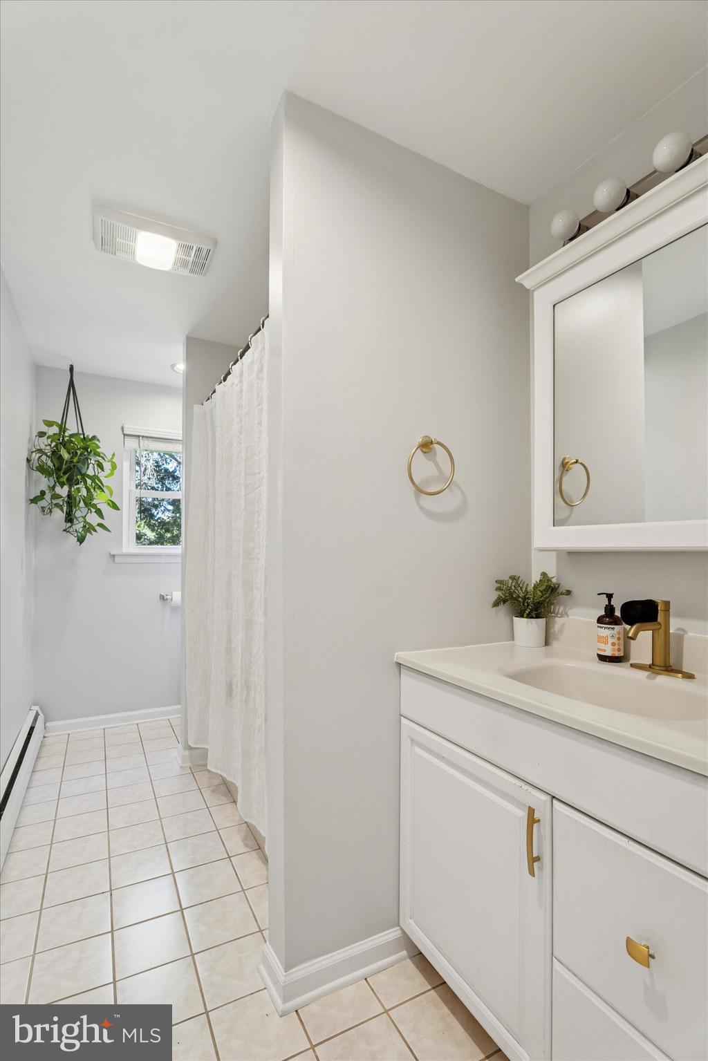 134-7 East 7 Stars Road Phoenixville, PA 19460 - Photo 12 of 25 a bathroom with a sink a mirror and a toilet