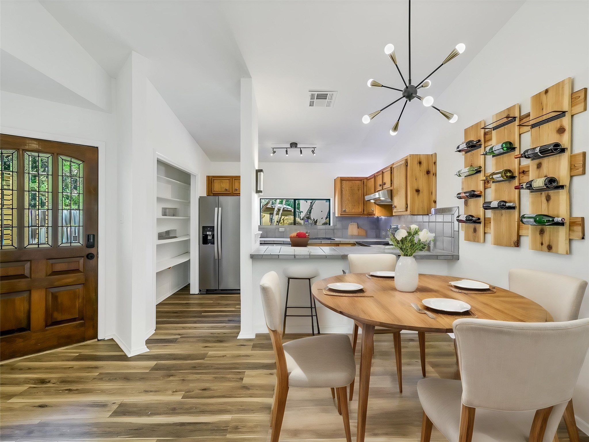 2712 Geronimo Trail Austin, TX 78734 - Photo 7 of 31 a view of a dining room with furniture and wooden floor