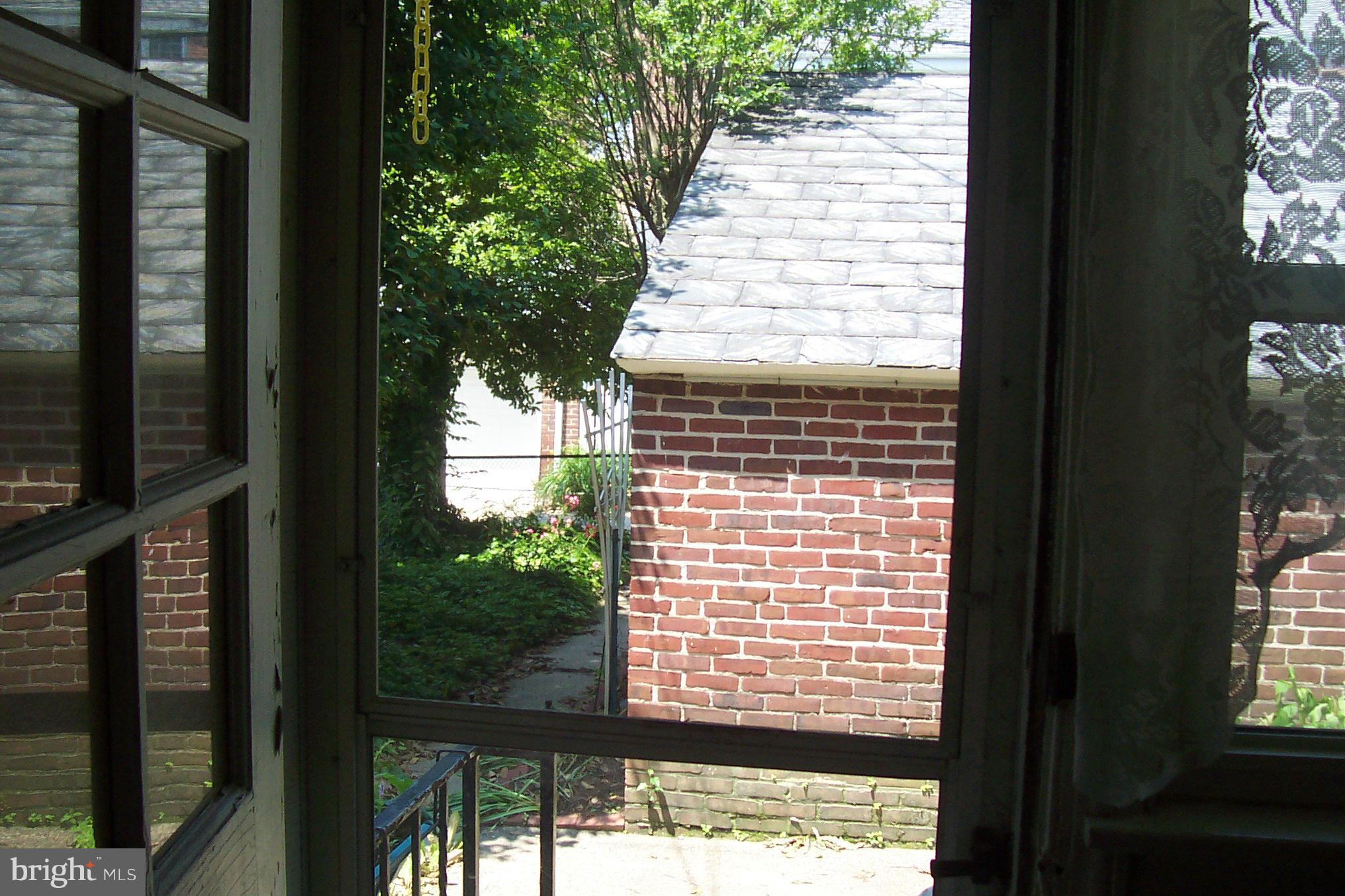 3704 Delverne Road Baltimore, MD 21218 - Photo 11 of 17 a view of a house with a tree