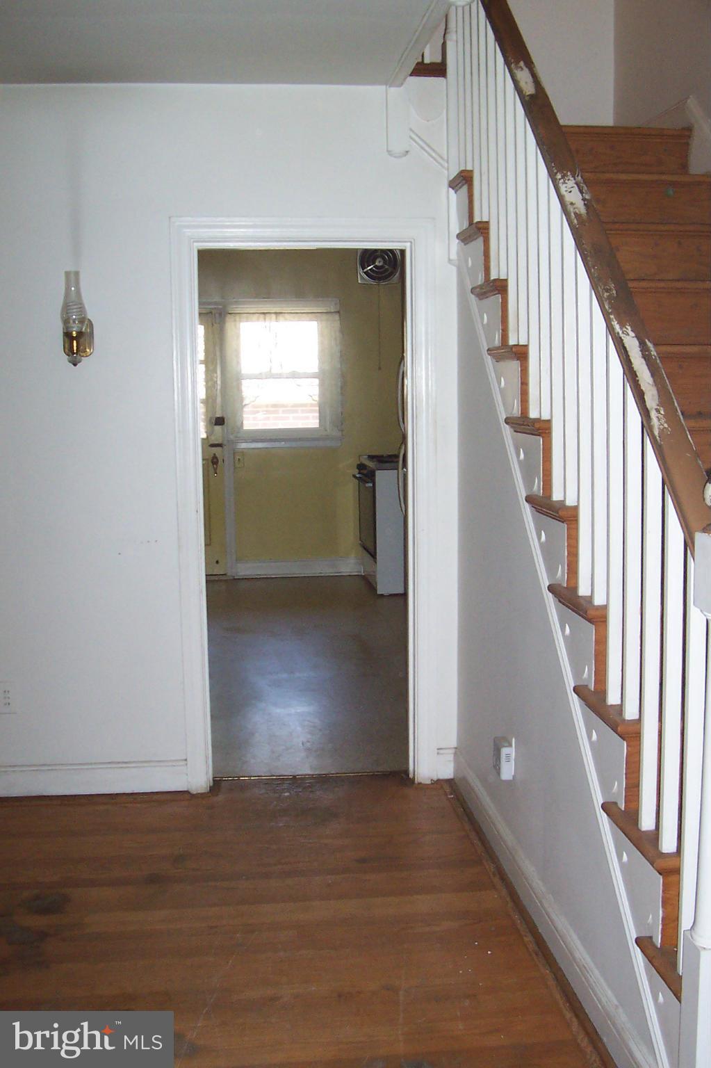 3704 Delverne Road Baltimore, MD 21218 - Photo 4 of 17 a view of entryway and hall with wooden floor
