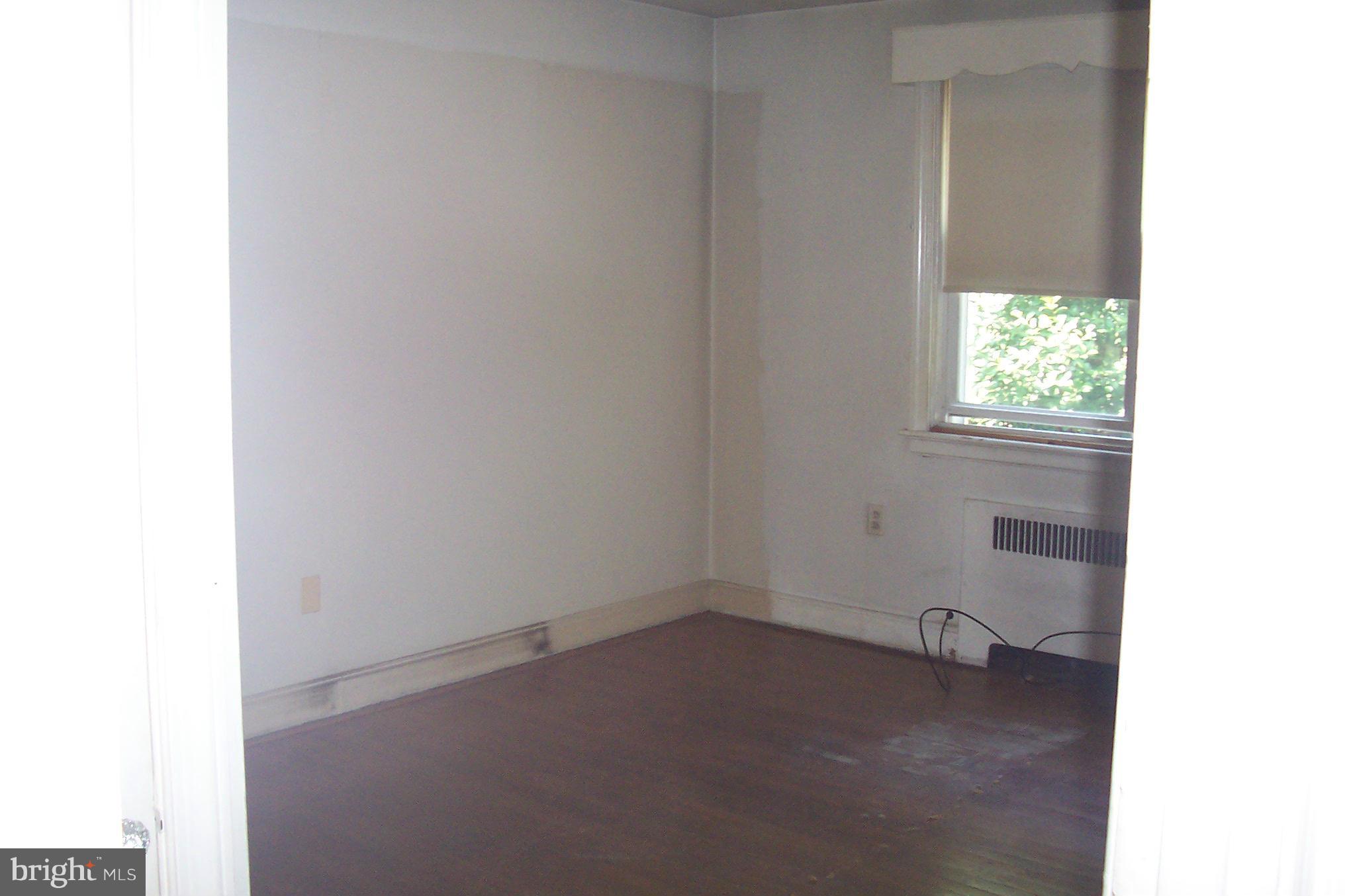 3704 Delverne Road Baltimore, MD 21218 - Photo 7 of 17 a room that has a window in it