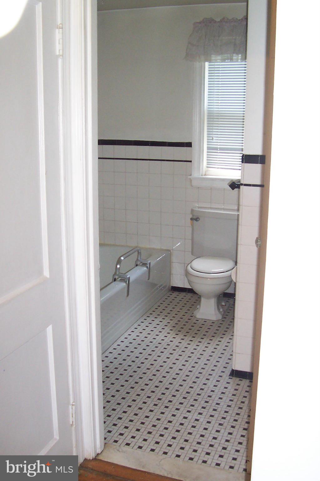 3704 Delverne Road Baltimore, MD 21218 - Photo 8 of 17 a bathroom with a toilet and a shower