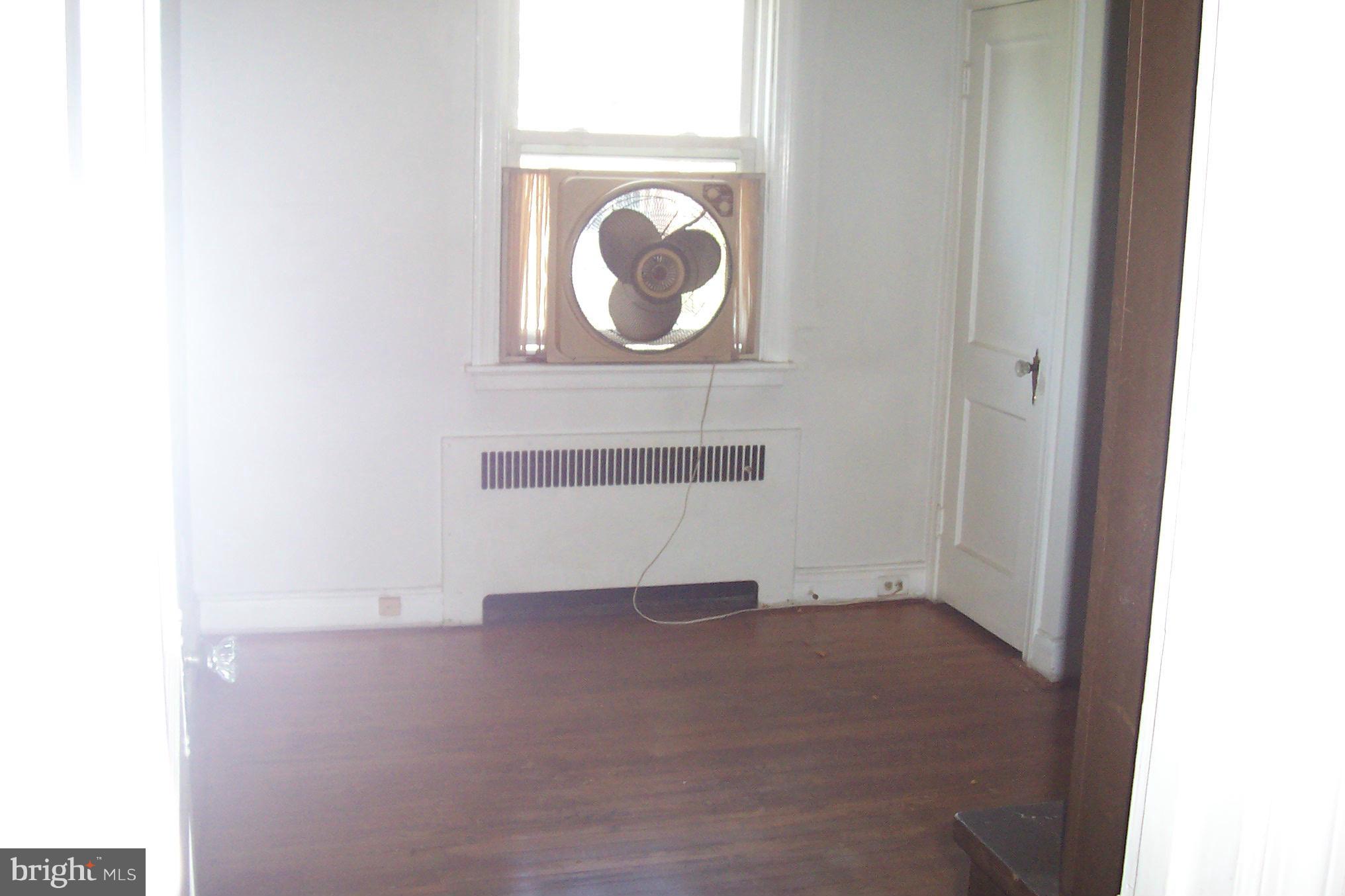 3704 Delverne Road Baltimore, MD 21218 - Photo 9 of 17 a view of a small space with racks on the wall