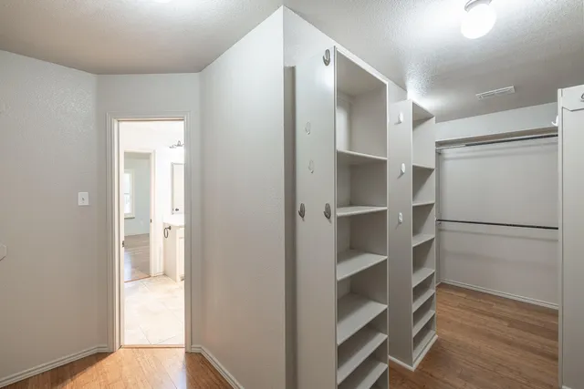 a view of an empty walk in closet