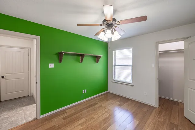 a view of storage and utility room with windows