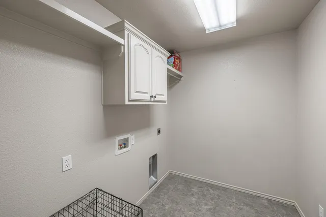 a view of a backyard with wooden fence