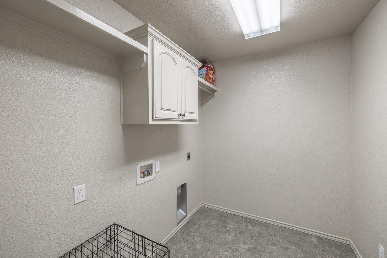 6406 93rd Street Lubbock, TX 79424 - Photo 32 of 40 a view of storage and utility room with windows