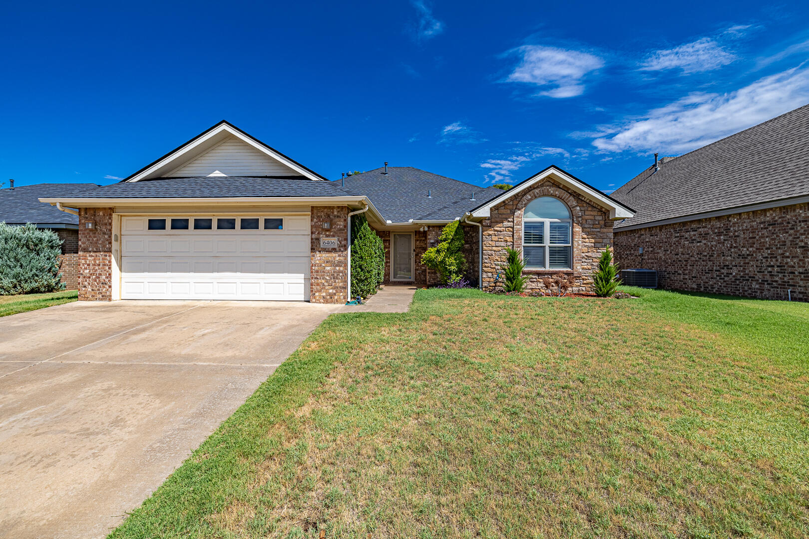 6406 93rd Street Lubbock, TX 79424 - Photo 40 of 40 a view of a house with a yard and garage
