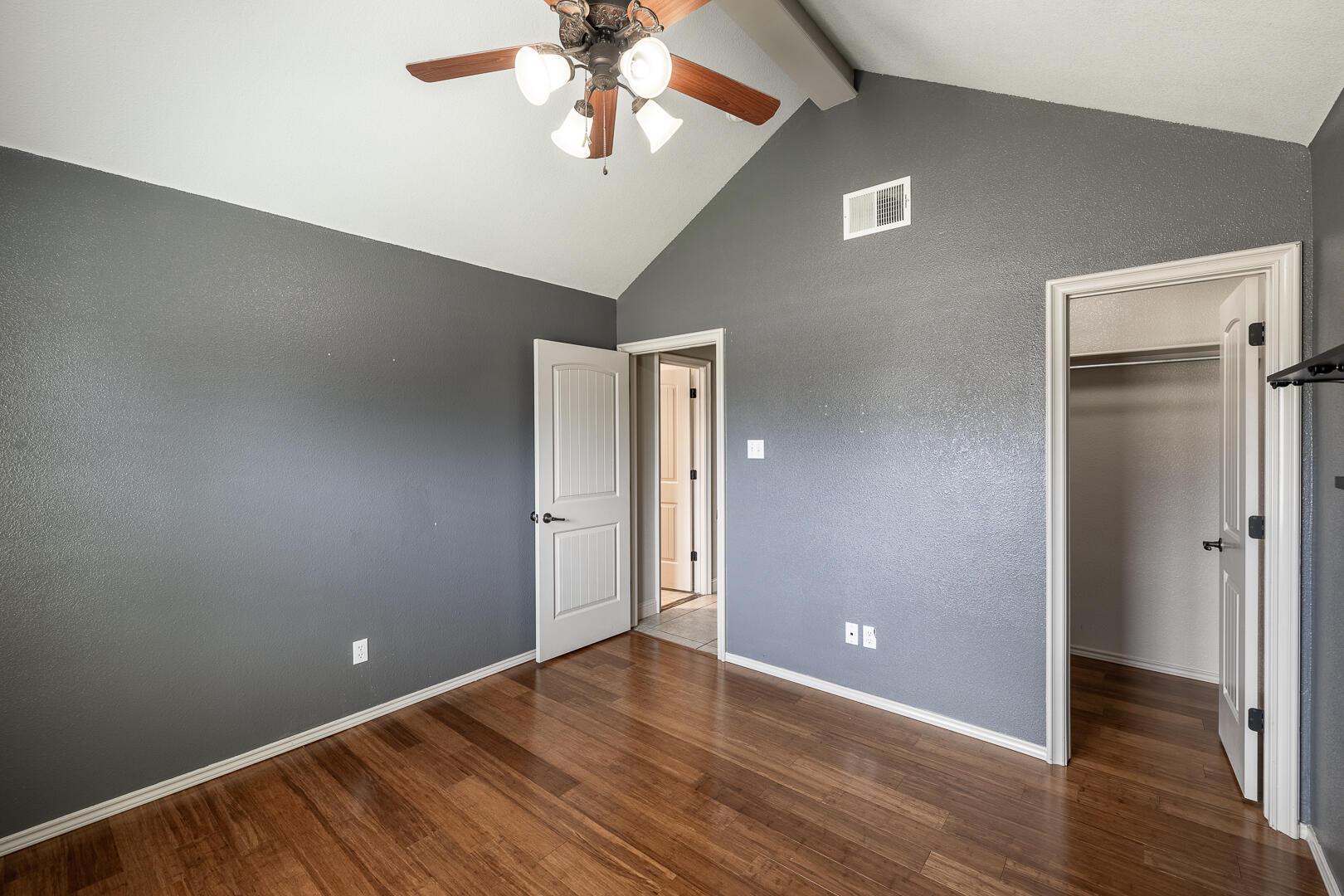 6406 93rd Street Lubbock, TX 79424 - Photo 5 of 40 a view of an empty room with wooden floor