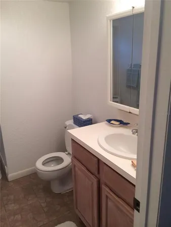 a bedroom with a bed and a lamp