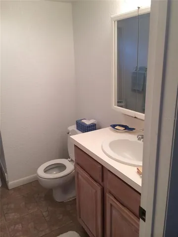 a bedroom with a bed and a lamp