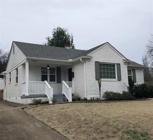 a front view of a house with garage
