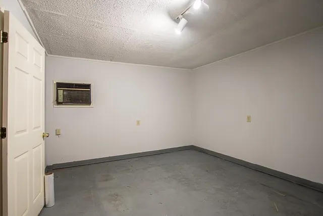 an empty room with a empty space and a window