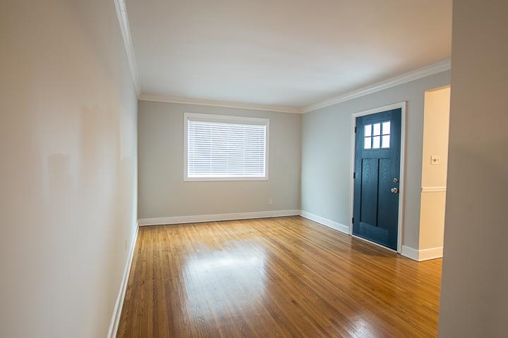 3780 Cardinal Avenue Memphis, TN 38111 - Photo 4 of 19 an empty room with wooden floor and a window