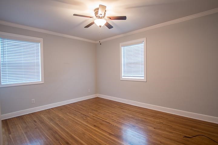 3780 Cardinal Avenue Memphis, TN 38111 - Photo 7 of 19 a view of empty room with wooden floor and fan