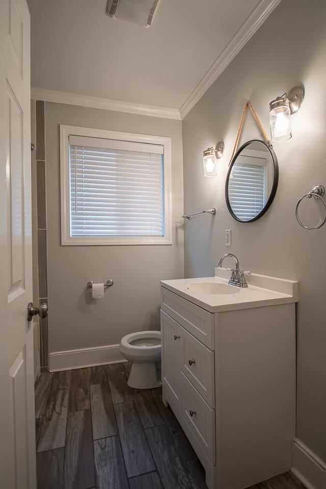 3780 Cardinal Avenue Memphis, TN 38111 - Photo 9 of 19 a bathroom with a toilet sink and mirror