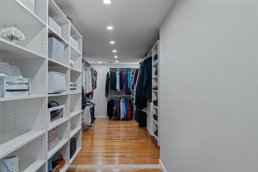 20 Walden Drive Walpole, MA 02081 - Photo 17 of 38 a view of walk in closet with clothes and shoes