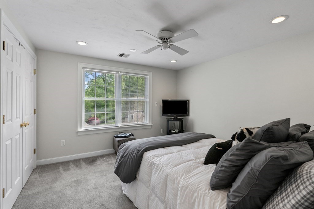 20 Walden Drive Walpole, MA 02081 - Photo 19 of 38 a bedroom with a bed and a tv