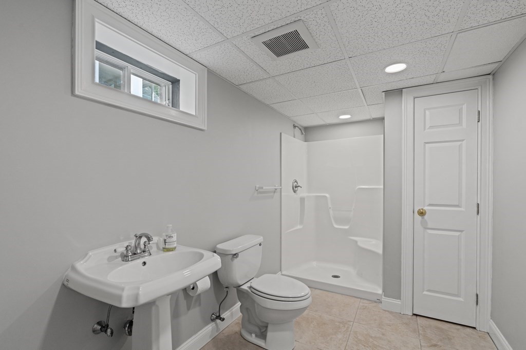 20 Walden Drive Walpole, MA 02081 - Photo 25 of 38 a bathroom with a sink toilet and shower