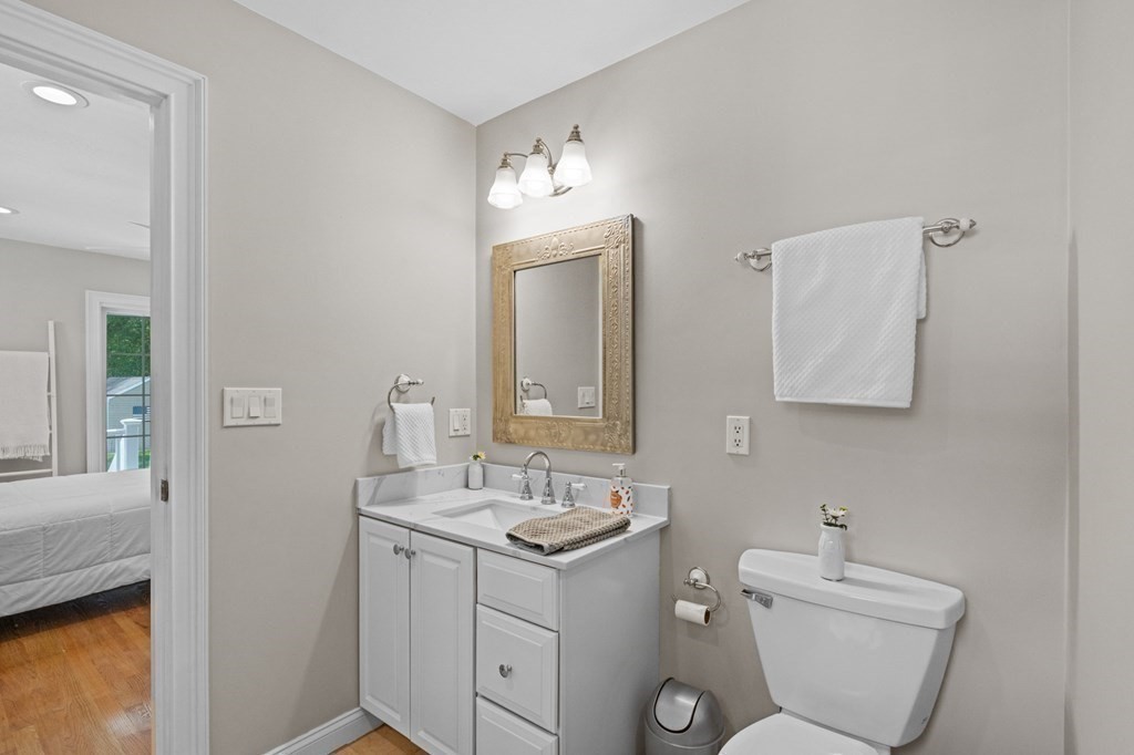 20 Walden Drive Walpole, MA 02081 - Photo 31 of 38 a bathroom with a toilet sink and mirror