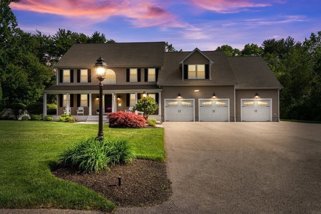 20 Walden Drive Walpole, MA 02081 - Photo 35 of 38 a front view of a house with a garden and a yard