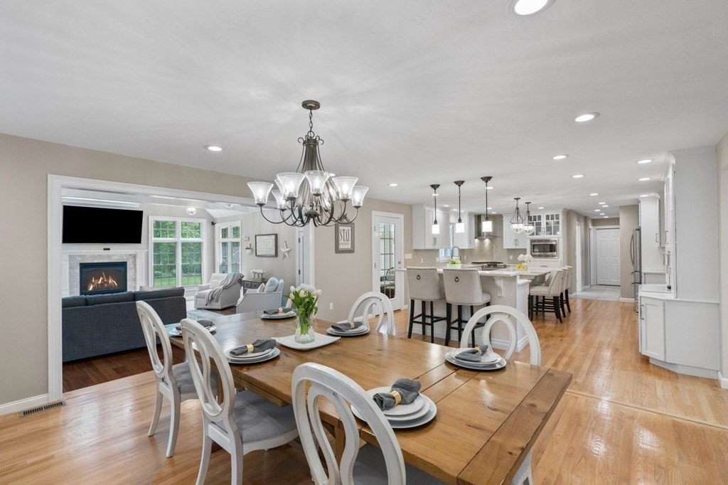 20 Walden Drive Walpole, MA 02081 - Photo 6 of 38 a view of a dining room with furniture wooden floor and chandelier