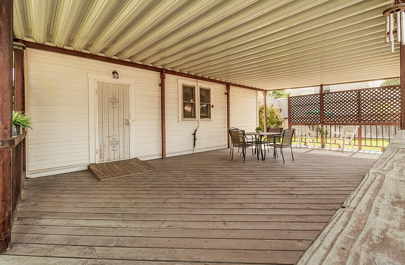 1005 L Street Reedley, CA 93654 - Photo 8 of 37 a big room with wooden floor