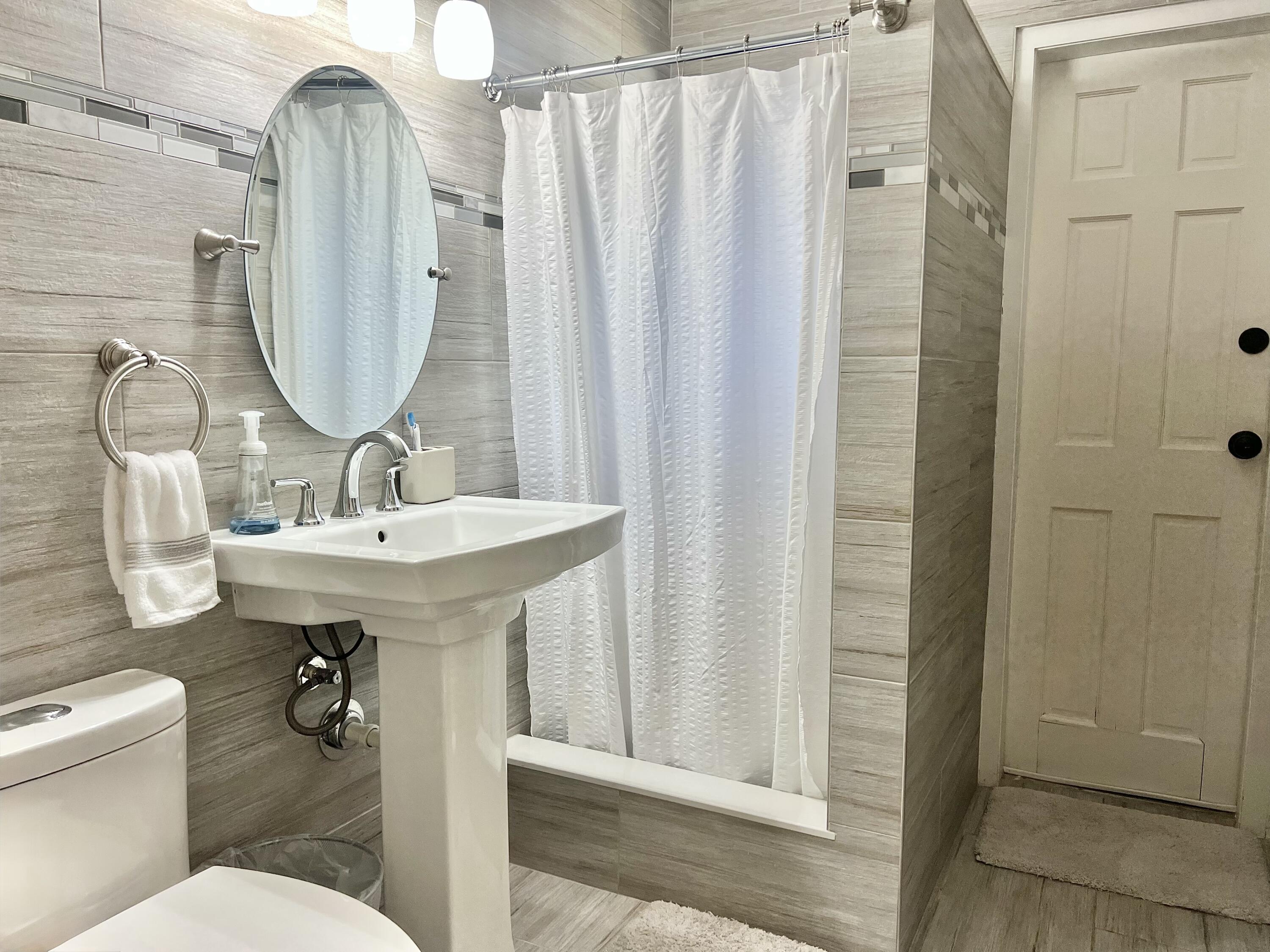 1505 Johnson Street Key West, FL 33040 - Photo 14 of 18 1505 Johnson Guest Bath & Door to Backya