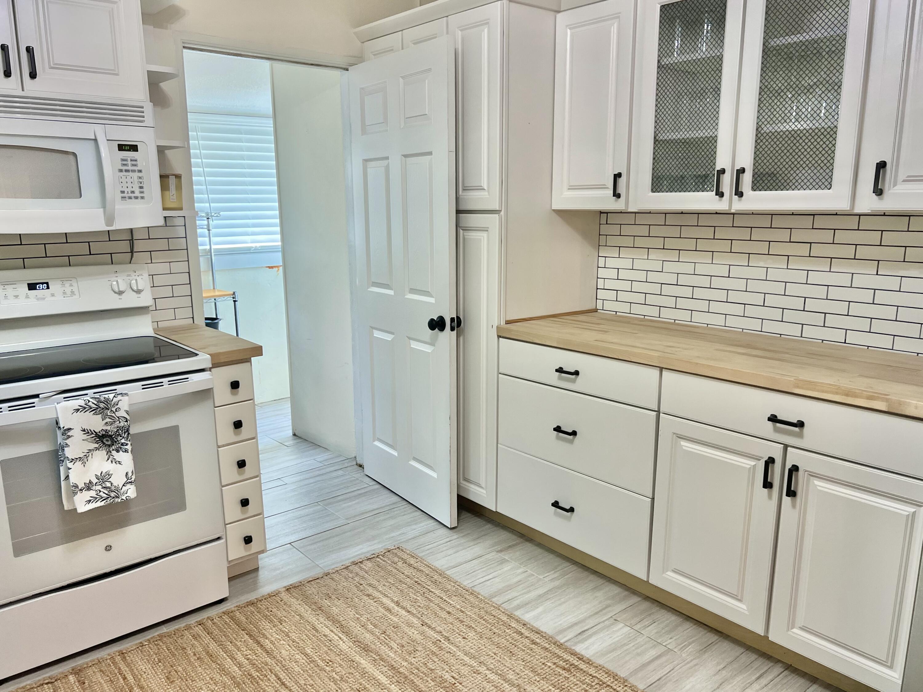 1505 Johnson Street Key West, FL 33040 - Photo 16 of 24 1505 Johnson Kitchen into Laundry