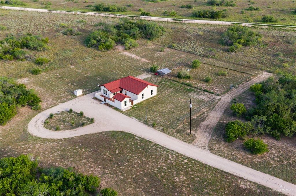 301 Pvt 755 Ranch Encino, TX 78353 - Photo 29 of 38 a wooden floor with some trees in the background