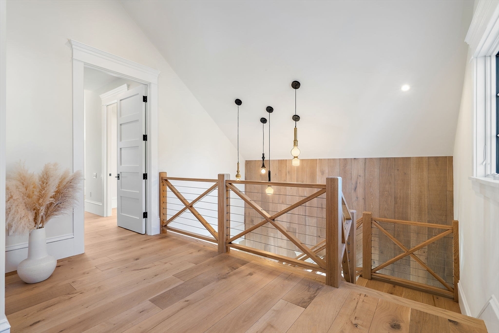 16 Hatch Farm Lane, Unit 16 Concord, MA 01742 - Photo 12 of 39 a view of a hallway with wooden floor