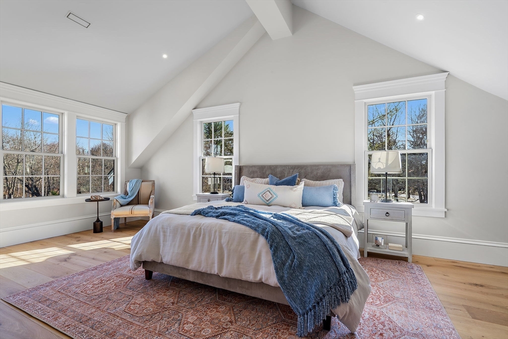 16 Hatch Farm Lane, Unit 16 Concord, MA 01742 - Photo 14 of 39 a bedroom with a bed and large window