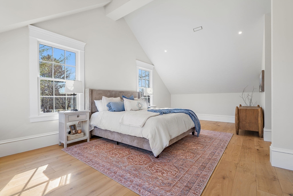 16 Hatch Farm Lane, Unit 16 Concord, MA 01742 - Photo 17 of 39 a bedroom with a bed and a couch