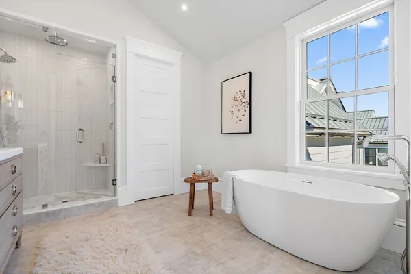 a bathroom with a bathtub and shower