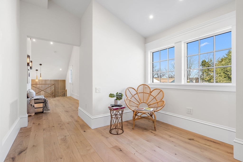 16 Hatch Farm Lane, Unit 16 Concord, MA 01742 - Photo 24 of 39 a living room with furniture and a wooden floor