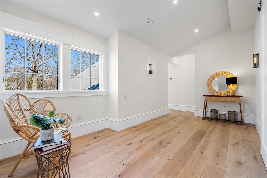 16 Hatch Farm Lane, Unit 16 Concord, MA 01742 - Photo 25 of 39 a living room with furniture and a wooden floor