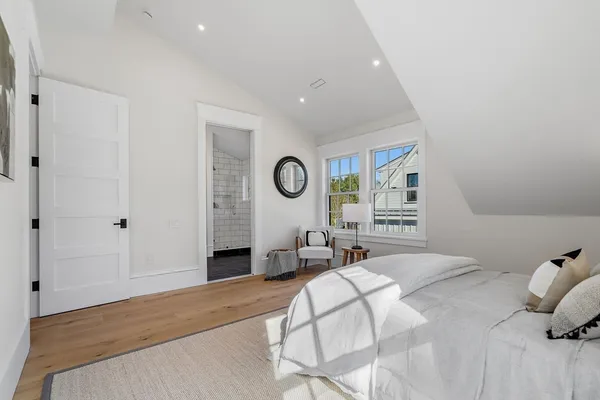 a bedroom with a bed and a table in it