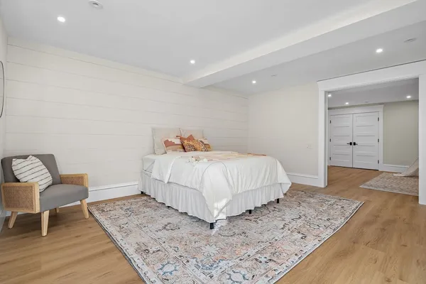 a bedroom with a bed and a table