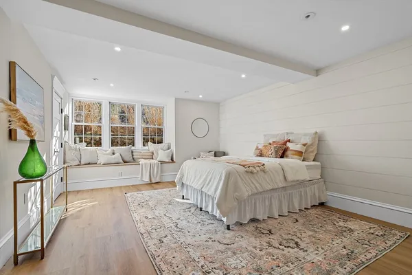 a bedroom with a large bed and a couch
