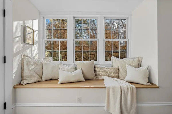 a living room with furniture and windows