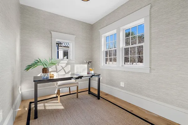 a workspace with furniture and a window