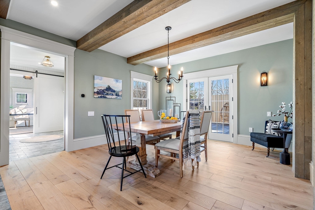 16 Hatch Farm Lane, Unit 16 Concord, MA 01742 - Photo 5 of 39 a view of a dining room with furniture and wooden floor