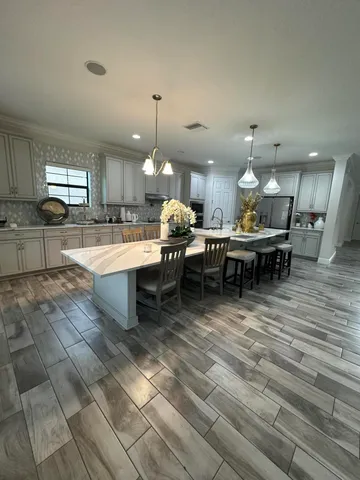 a kitchen with a sink cabinets and stainless steel appliances