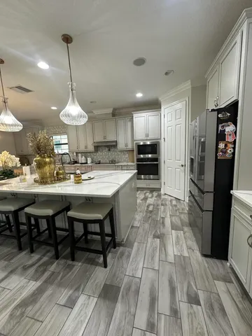 a view of entryway with wooden floor