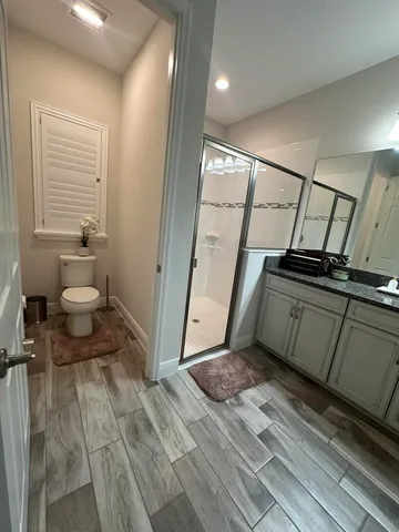 a bedroom with a bed and a television