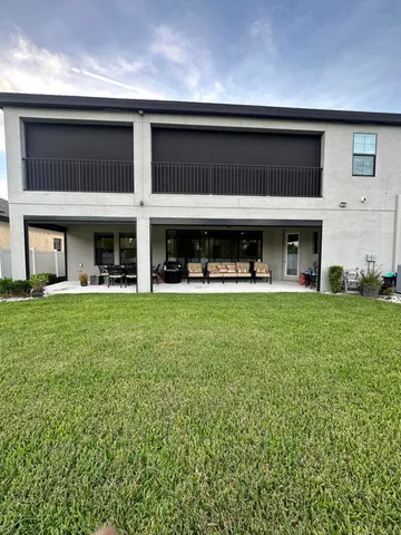a view of an outdoor space and tennis court