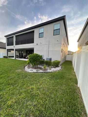 a swimming pool view with a seating space