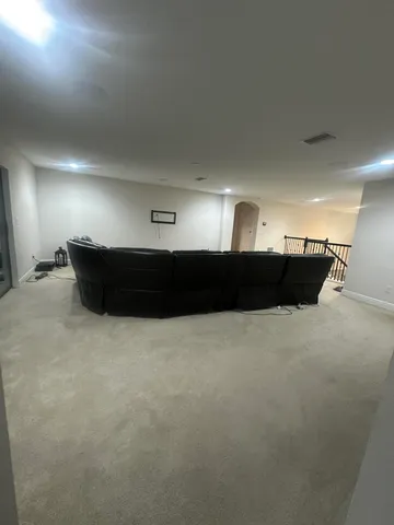 a house with lots of trees in the background